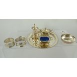 A STERLING SILVER THREE-PIECE CONDIMENT SET, a beaded rim WAITER, 16cm diameter, two silver NAPKIN