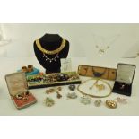 A COLLECTION OF COSTUME JEWELLERY to include; two gold plated chokers, bead necklaces, pendant