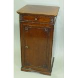 A LATE VICTORIAN MAHOGANY BEDSIDE CUPBOARD fitted drawer over door to base, 41cm wide