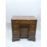 AN 18TH CENTURY GEORGIAN MAHOGANY DESK of pedestal form, fitted one long and six small drawers, with