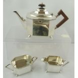 AN EPNS THREE PIECE TEA SET of elongated octagonal form with applied wire banding and plain body,