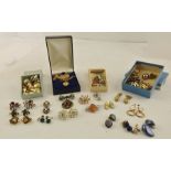 A LARGE COLLECTION OF COSTUME EARRINGS, two brooches, a heart pendant and various chains