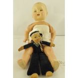 A 1930's ENGLISH DOLL having moulded head with mobile eyes, fabric body and jointed composition