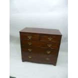 A GEORGE III MAHOGANY CHEST OF TWO SHORT OVER THREE LONG DRAWERS, with pierced brass back plate swan