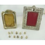 A SELECTION OF ITEMS comprising two table top silver photograph frames, 23cm x 18cm, and 19cm x 13cm