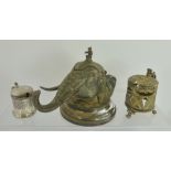 A VICTORIAN EPNS DESK INKWELL fashioned as an elephant head, having hinged skull cap with monkey