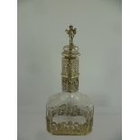 A 19TH CENTURY CONTINENTAL LIQUEUR DECANTER having wheel engraved glass with decorative white