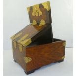 A 20TH CENTURY ORIENTAL BRASS BOUND AND POLISHED HARDWOOD VANITY BOX, having double hinged lid,