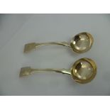 JONATHAN HAYNE A PAIR OF GEORGE IV SILVER SAUCE LADLES in fiddle pattern with engraved lion crest,