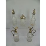 A COMPOSITE SUITE OF FIVE GEORGIAN AND VICTORIAN SILVER AND LEAD CRYSTAL DECANTER BOTTLES, having