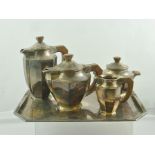 AN ART DECO DESIGN SILVER PLATED FOUR PIECE TEA SET comprising tea pot, hot water jug, milk jug