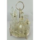 A 19TH CENTURY ELECTRO-PLATE GEORGIAN STYLE SEVEN-BOTTLE CRUET, having central column and handle,