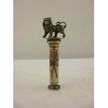SAMPSON MORDAN & CO. A DESK TOP PEN AND SEAL SET having cast figure of a lion supported on a column,