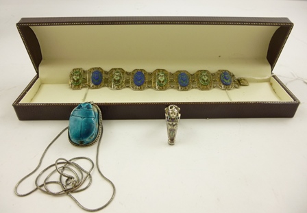 AN EGYPTIAN REVIVAL SILVER BRACELET, a large old Scarab mounted in silver coloured metal and a