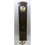 AN EDWARDIAN OAK LONG CASE CLOCK having circular dial with Arabic numerals, eight day with chiming