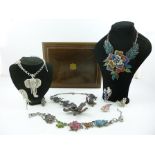 A COLLECTION OF NINE ITEMS OF BUTLER & WILSON JEWELLERY principally from the 1970's in a mahogany