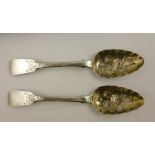 A PAIR OF GEORGIAN FIDDLE PATTERN SILVER TABLE SPOONS having later fruit decoration, with gilt