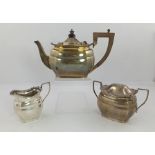 COOPER BROS & SONS A GEORGE V THREE PIECE SILVER TEASET having ridged and panelled belly, applied