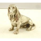 ALBERT EDWARD JONES A CAST SILVER MODEL OF A SEATED BASSET HOUND, Birmingham 1975, 532g.