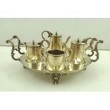 A 19TH CENTURY SILVER PLATE NOVELTY FOUR PIECE CRUET in the form of a miniature tea service, oval