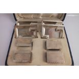 MAPPIN & WEBB AN ART DECO DESIGN SILVER SMOKING SET, comprising four individual ashtrays and four