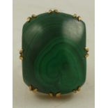 A MALACHITE AND GOLD COLOURED METAL MOUNTED 8/8 DRESS RING, in claw setting, size M