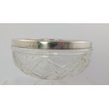 BURTONS & WATERS AN EARLY TO MID 20TH CENTURY CUT GLASS FRUIT BOWL with silver band to rim,