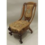 A VICTORIAN CARVED SWEEPING FRAMED SALON CHAIR on carved cabriole fore supports, remains of original