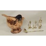 A 19TH CENTURY COPPER HELMET SHAPED COAL SCUTTLE with swing handle, containing a selection of