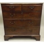 A PART GEORGIAN (with later alterations) MAHOGANY CHEST, having later plank top with chamfered top