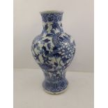 A 19TH CENTURY KANGXI DESIGN BALUSTER PORCELAIN VASE decorated with a four claw dragon flora and