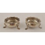 JAMES DEAKIN & SONS A PAIR OF GEORGIAN STYLE SILVER SALTS each having cast fancy gadroon rim, raised