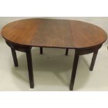 A GEORGE III DESIGN MAHOGANY CIRCULAR DINING TABLE consisting of a pair of demi lunes with plain