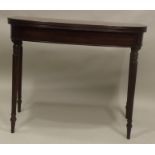 A 20TH CENTURY GEORGIAN STYLE MAHOGANY TEA TABLE having demi-lune top, raised on four turned