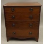 A GEORGIAN MAHOGANY COMMODE (with later alterations), having hinged plank lift-up top with ebony