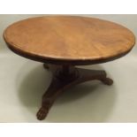 A VICTORIAN MAHOGANY BREAKFAST TABLE, having two-piece top with moulded edge facetted column and