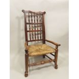 A VICTORIAN ELM AND ASH VERNACULAR ARMCHAIR, having three row spindle back, strung seat and turned