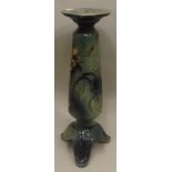 A LATE 19TH/20TH CENTURY EARTHENWARE JARDINIERE STAND allover glazed in mottled green glaze, moulded