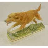 ROYAL WORCESTER MODELLED BY DORIS LINDNERA MODEL OF A GOLDEN RETRIEVER, running, on a naturalistic