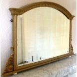 A VICTORIAN GILT FRAMED OVERMANTEL MIRROR, having arched top with acanthus frieze, bound reeded