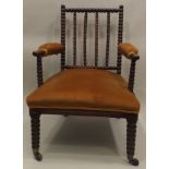 A LATE 19TH/EARLY 20TH CENTURY SIMULATED ROSEWOOD "BOBBIN" ARMCHAIR, having gold velour