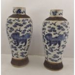 A PAIR OF DECORATIVE 20TH CENTURY CHINESE VASES each having tooled banding and decorated in under