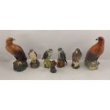 AFTER J.G. TONGUE A COLLECTION OF SEVEN BESWICK EARTHENWARE BENEAGLES WHISKY DECANTERS, Merlin,