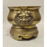 A MEIJI PERIOD BRONZE CENSER cast as Dog of Fo handles on shaped plinth base, 24cm high