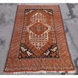 A TURKOMAN RUG having shaped central motif with stylised bird decoration, also to the corners of the