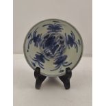 AN 18TH CENTURY CHINESE SHALLOW BOWL, raised sole, hand painted cobalt blue stylised flowers, 10cm