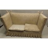 A KNOLE SETTEE, all over upholstered in a golden print