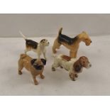 FOUR BESWICK DOGS; Spaniel, Pug, Wire haired Terrier and a Hound