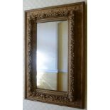 A PAIR OF LATE VICTORIAN GILT GESSO DECORATIVELY MOULDED WALL MIRRORS, plate size 50cm x 24cm