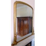 A 19TH CENTURY GILT FRAMED OVERMANTEL MIRROR, arched top with moulded frame, leaf moulded decoration